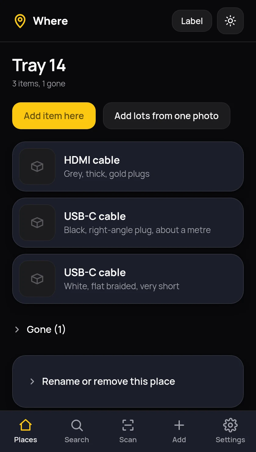 The Tray 14 page in Where, listing an HDMI cable and two USB-C cables with their descriptions, a collapsed section for items marked gone, and buttons to add an item or add lots from one photo.